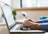 5 Best Email Spam Checker Tools in 2021 man writing email