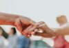 9 Factors That Affect Senior Citizen Health Plan Premiums A close-up of hands shaking Description automatically generated with medium confidence