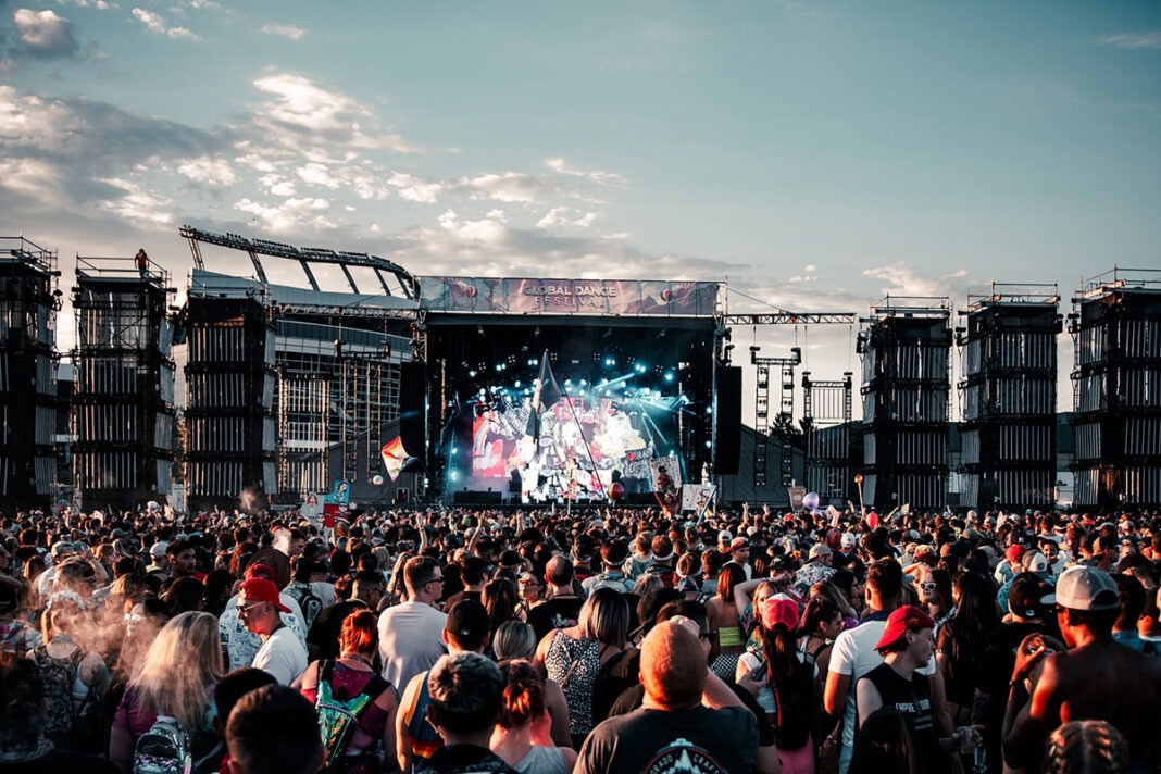 a-large-crowd-of-people-at-a-concert-description A large crowd of people at a concert Description automatically generated