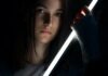 Most Unique Lightsabers in the Galaxy woman in gray long sleeve shirt holding black bottle