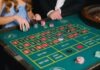 How to Play Craps? Guide for Beginners A Person Holding Casino Chips