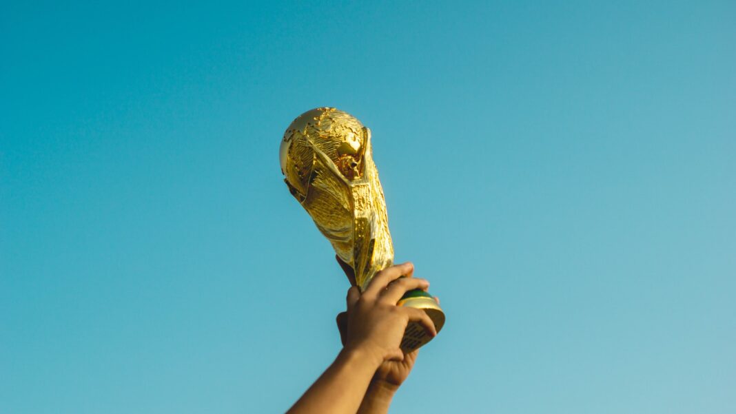 Photo by Fauzan Saari person holding gold trophy