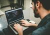6 Best Practices to Improve Node.js Security man programming using laptop