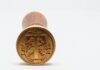 7 Ways to Use Custom Stamps round gold-colored coin on white surface