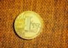 How Will Litecoin Beat Bitcoin in the Future? silver round coin on brown textile