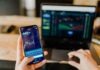 Trade crypto and make 1k daily person using phone and laptop computer