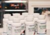 6 amazing benefits of Irish sea moss white plastic bottles on white table