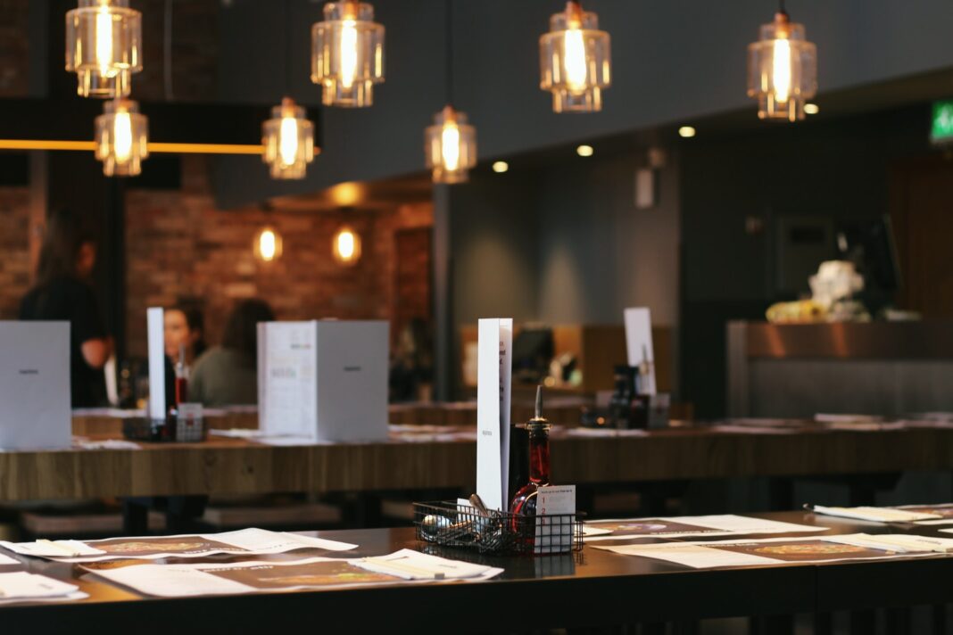Photo by Samuel Foster menu on brown table