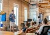 What do Venture Capitalists Look For in a Business Proposal? man standing in front of group of men
