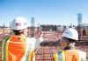 Seven Cities Seeing a Boom in Construction Business man in white hard hat standing on brown wooden dock during daytime