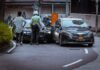 Self-Driving Vehicles and Accidents – Who’s at Fault? man in white and black stripe shirt and black pants standing beside black car during daytime