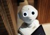 Invest In Crypto With Bitcoin System Trading Robot white robot near brown wall