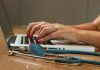 When is the Best Time to Buy Medical Insurance Policy in India? person sitting while using laptop computer and green stethoscope near