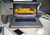 Design your eCommerce with flexibility turned on MacBook Pro beside gray mug