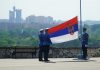 Latest Trends of Bitcoin Trading in Serbia man in black jacket standing near flag of us a during daytime