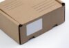 Safety Tips for Packaging & Mailing Fragile Products brown cardboard box on white table