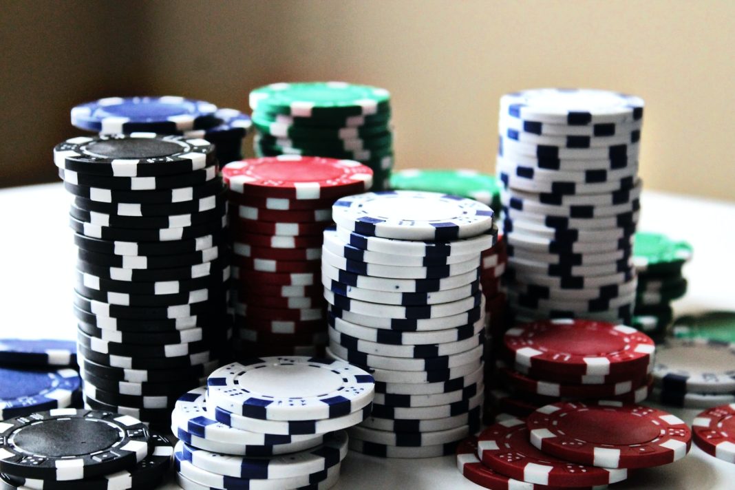 Photo by Amanda Jones stacked poker chips with different colors