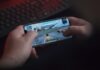 10 Most Popular Mobile Games in 2022 person holding black samsung android smartphone