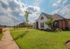 Are Single Family or Multi-Family Homes Better for Real Estate Investors?  white and brown house near green grass field under white clouds and blue sky during daytime