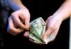 Best Payment Methods at Online Casinos person holding fan of 100 us dollar bill