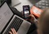 Importance of Effective UI/UX in Mobile App Development person holding black iphone 4