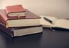 What to look for in a Tax Relief company selective focus photography of three books beside opened notebook