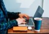 What Different Casino Software Providers Are Available person wearing blue and green plaid collared button-up long-sleeved shirt sitting while using MacBook Pro
