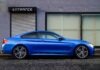Finding the best Car Loans Online? Consider These Tips for Better Results blue coupe beside gray house