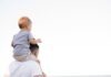 How ULIPs Can Help You With Your Life Goals man in white shirt carrying boy