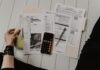 How Can I get tax forgiveness? person holding paper near pen and calculator
