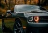 What are Muscle Cars and How Can You Purchase One?  black porsche 911 parked on dirt road during daytime