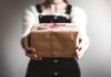 Tips for Finding the Best Gift for Your Loved One person showing brown gift box