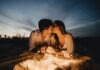Outside Dating Tips: A Fun and Creative Things to Do man and woman kissing on brown sand during night time