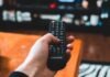 SVOD, TVOD and AVOD – The “Whales” of the OTT Market person holding black remote control