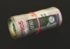 Online Tactics to Fundraise for a Cause or Business rolled banknotes