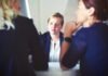 How to Streamline Your HR Department  three women sitting beside table