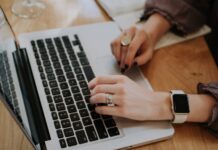 How to Make Money on Your Own Website? person using MacBook