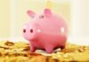 Tips for a Healthier Financial Life in 2023 and Beyond pink pig coin bank on brown wooden table
