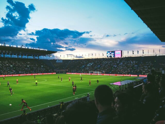 Photo by Fancy Crave people watching soccer arena