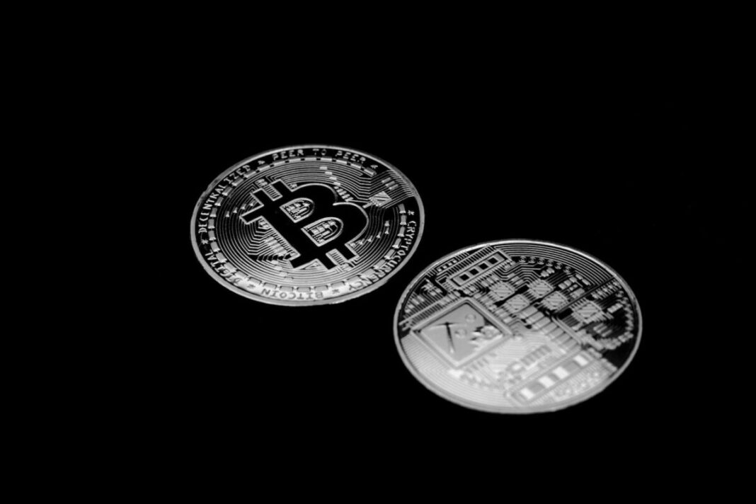 Photo by Daniel Dan The Front and Back Faces of Bitcoins