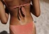 9 Self-Tanner Mistakes Everyone Should Stop Doing Woman's Back in Red Bikini
