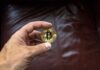 Can Bitcoin Fix Your Broken Saving Model? Round Gold-colored and Black Coin on Person's Hand