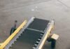 The Advantages of Custom Conveyor System black and brown industrial machine