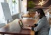 I Need Temporary Phone Numbers. How Can I Get Temporary Unlimited Phone Numbers? woman in gray and white striped long sleeve shirt using silver macbook