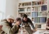 Business Insider: Why Successful Products and Businesses Have a Human Touch three men laughing while looking in the laptop inside room