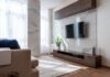 Harnessing the Power of Actuators for Smart Automation: Exploring Cutting-Edge Applications Modern TV set hanging on wall between wooden cabinets in front of comfortable sofa in light living room