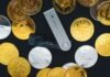 What Are Custodial & Non-custodial Crypto Wallets? a close up of a bunch of gold coins