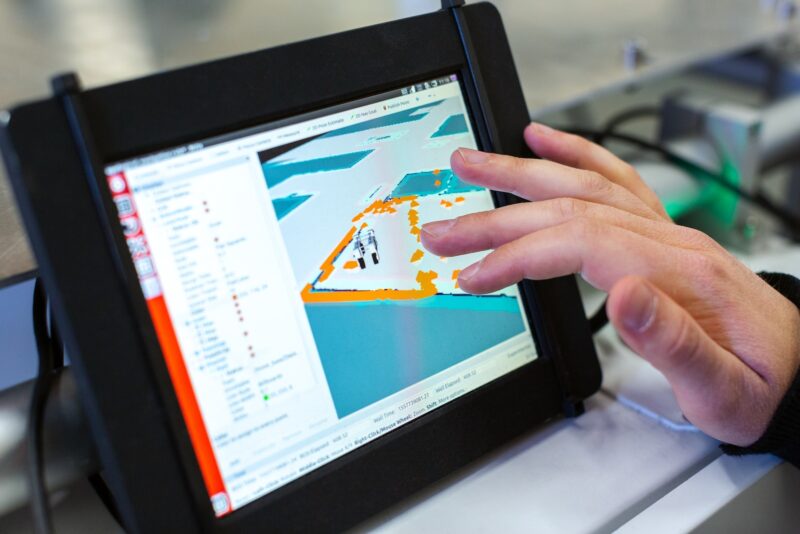 Photo by ThisisEngineering RAEng person holding black tablet computer