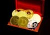 What Were the First Cryptocurrencies and Who Has Become Millionaires From Crypto? gold and red round coins