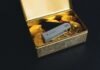 How to Protect Your Bitcoin From Scammers? a swiss army knife sitting in a box of gold coins